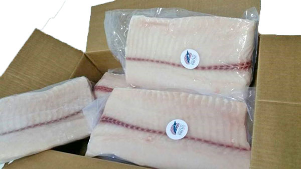 A photograph of individual vacuum packed and frozen paiche fillets